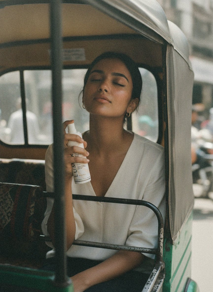 Re-misting Lumira Shield Mist in an auto-rickshaw, morning side-light